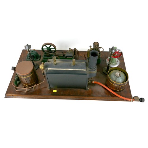 107 - A live steam engine display layout, mounted to a wooden base, with Stuart horizontal single piston e... 