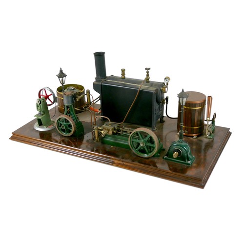 107 - A live steam engine display layout, mounted to a wooden base, with Stuart horizontal single piston e... 