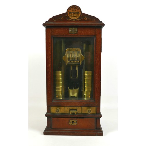 70 - A Victorian Sovereign change machine 'W. H. Ell's Patent Safecheck', the mahogany cabinet with glaze... 