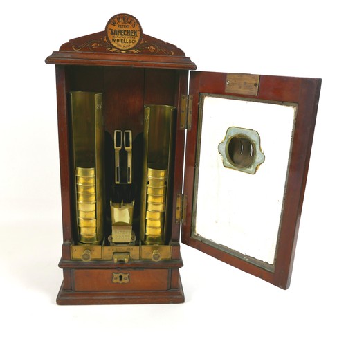 70 - A Victorian Sovereign change machine 'W. H. Ell's Patent Safecheck', the mahogany cabinet with glaze... 