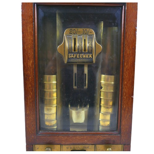 70 - A Victorian Sovereign change machine 'W. H. Ell's Patent Safecheck', the mahogany cabinet with glaze... 