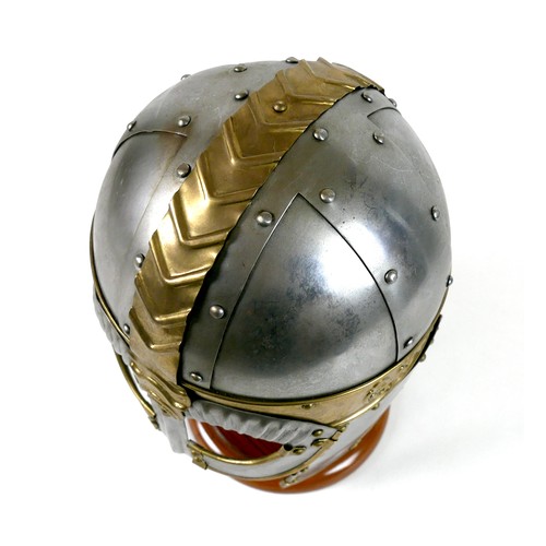 66 - A replica metal steel and brass helmet, with cheek plates, hinged ear flaps, and chain mail neck gua... 