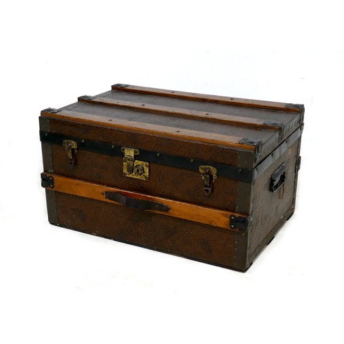 190 - An Edwardian travelling trunk, wooden bound and leather effect covering, labelled inside 'H. Dumioan... 