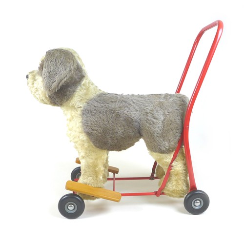 90 - A mid-20th century Lines Brothers push-along baby walker, in the form of a dog, light brown mohair w... 