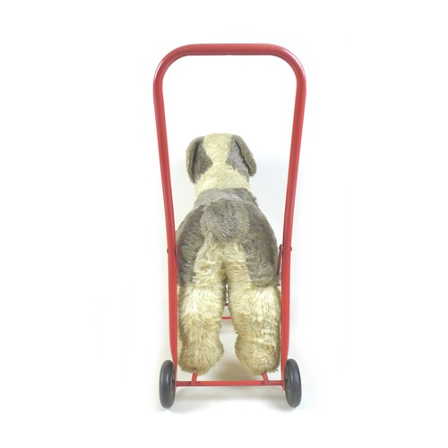 90 - A mid-20th century Lines Brothers push-along baby walker, in the form of a dog, light brown mohair w... 