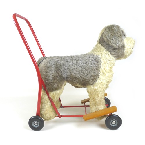 90 - A mid-20th century Lines Brothers push-along baby walker, in the form of a dog, light brown mohair w... 