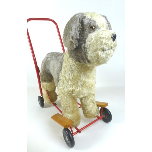 90 - A mid-20th century Lines Brothers push-along baby walker, in the form of a dog, light brown mohair w... 