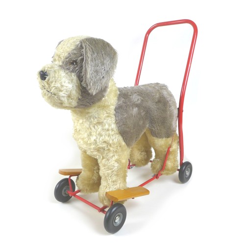 90 - A mid-20th century Lines Brothers push-along baby walker, in the form of a dog, light brown mohair w... 