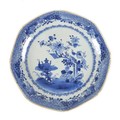 A Chinese Export porcelain dish, 19th century, decorated in underglaze blue, depicting a table with ... 