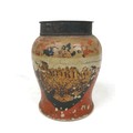 A Victorian painted pottery tobacco jar, with a tin lid, the body decorated in gilt over red paint w... 