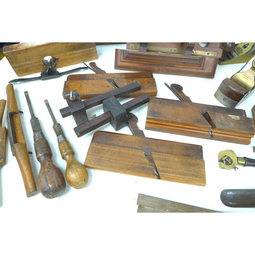 74 - A collection of vintage wooden tools, including a Holland wood plane, housed in a metal container. (... 