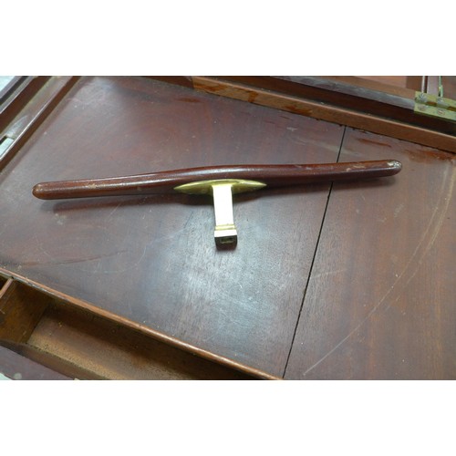 72 - A Georgian mahogany writing slope, with secret drawer and brass campaign handles, 44 by 29 by 13.5cm... 