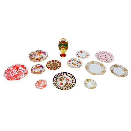34 - A collection of Royal Crown Derby comprising a urn decorated with floral sprays in red yellow green ... 