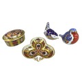 A group of four Royal Crown Derby bone china items, comprising ‘Robin’ paperweight, ‘Wren’ paperweig... 