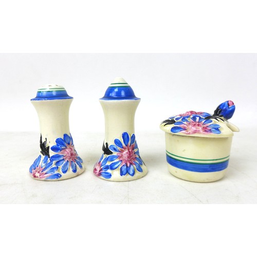 39 - A Clarice Cliff 'Marguerite' Muffineer cruet set, relief moulded with flowers and foliage picked out... 