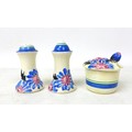 A Clarice Cliff 'Marguerite' Muffineer cruet set, relief moulded with flowers and foliage picked out... 