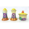 A Clarice Cliff 'Gay Day' Muffineer cruet set, Bizarre mark to the base, tallest 8cm high. (3)