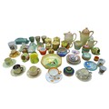 A large group of mixed ceramics, including teacups, sugar bowls, milk jugs, coffee pots and dishes. ... 