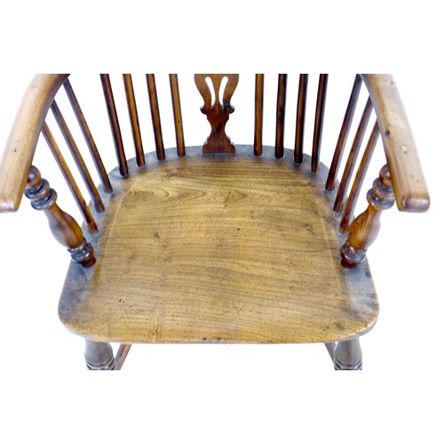 268 - An early 19th century oak and elm Windsor chair, with pierced splat and spindle back, raised on turn... 