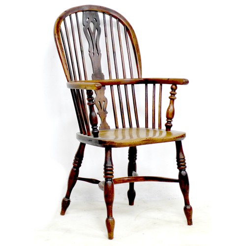 268 - An early 19th century oak and elm Windsor chair, with pierced splat and spindle back, raised on turn... 