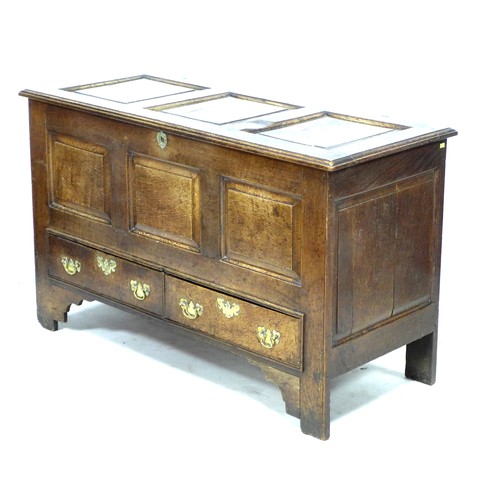 275 - An 18th century oak mule chest, with three carved panels to the front, over two drawers, raised on s... 