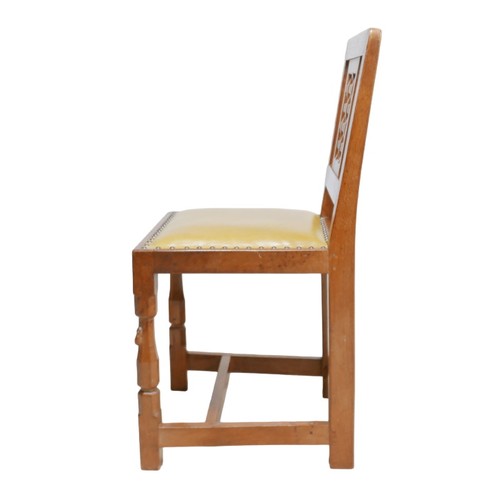 282 - Robert 'Mouseman' Thompson of Kilburn (British, 1876-1955): a set of eight oak dining chairs, lattic... 