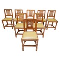 Robert 'Mouseman' Thompson of Kilburn (British, 1876-1955): a set of eight oak dining chairs, lattic... 