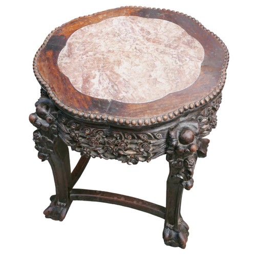 262 - A 19th century Chinese circular hardwood jardiniere stand, carved with prunus blossom, the marble in... 