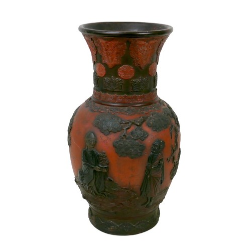 5A - A 20th century Chinese style terracotta vase, decorated with relief depiction of a demon with a holy... 