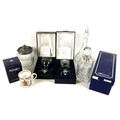 A group of cut glass items, comprising a Broadway silver mounted decanter, a Stuart cut crystal deca... 