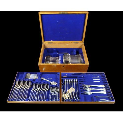 A collection of George III and later silver cutlery, King's pattern, terminals armorial engraved, seventy-one pieces, comprising twenty one table forks, 20.5cm, twelve table spoons, 23cm, twelve desert forks, 17cm, thirteen desert spoons, 18cm, twelve teaspoons, 14cm, fish slice, 31.5cm, and sugar tongs, 13.5cm, combined total weight 183.5toz, all housed in a mid 20th century oak fitted canteen with brass plaque engraved 'P.D. Roome', 47 by 33 by 18cm high.