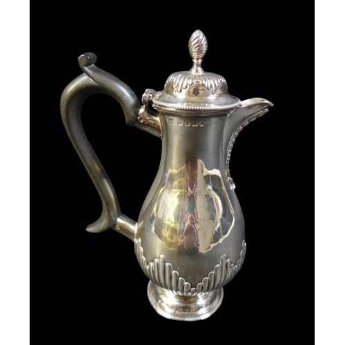 73 - A Victorian silver coffee pot, of baluster form with reeded decoration, ebonised handle, on a circul... 