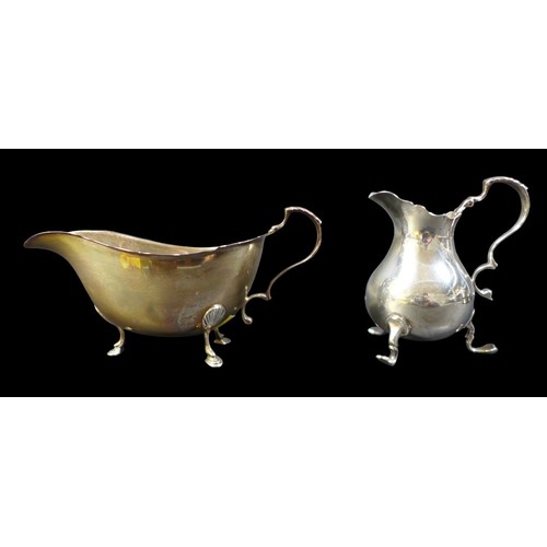 75 - A group of silver items, including an Edwardian silver bowl, of boat form with pierced sides and rim... 