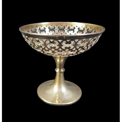 75 - A group of silver items, including an Edwardian silver bowl, of boat form with pierced sides and rim... 