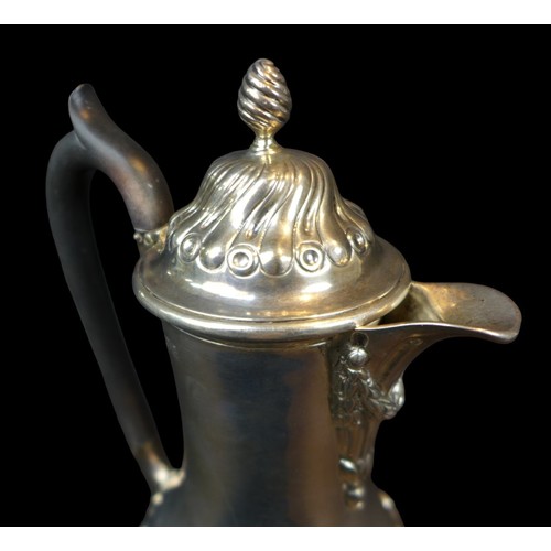 86 - A Victorian silver coffee pot, with lobed decoration to lid and base, an ebonised handle, Daniel & J... 
