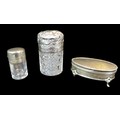 Three Victorian silver topped dressing table bottles, comprising an Edwardian cylindrical form silve... 