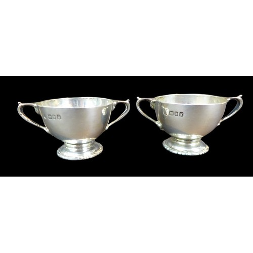 77 - Five pieces of Edwardian and later silver, comprising a pair of bon bon dishes with pierced decorati... 