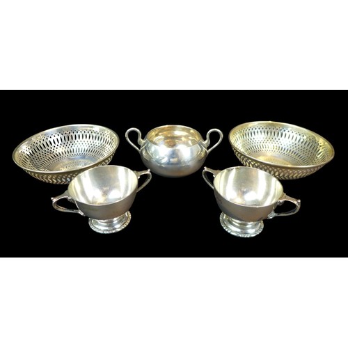 77 - Five pieces of Edwardian and later silver, comprising a pair of bon bon dishes with pierced decorati... 
