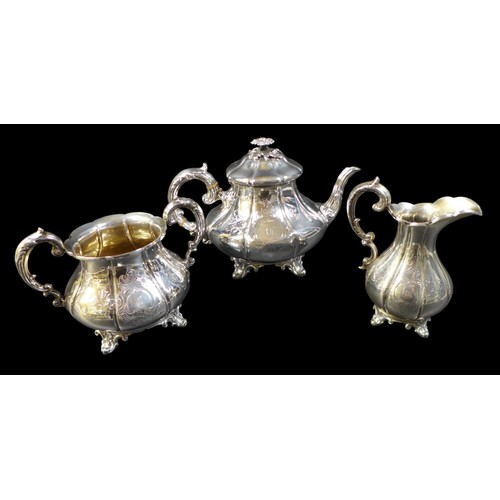 106 - A Victorian silver three piece tea service, of lobed squat baluster form with scalloped rims, engrav... 