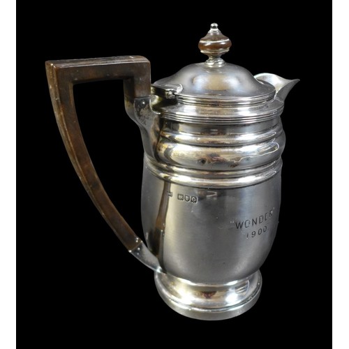 80 - A late Victorian silver hot water pot, with presentation engraving to the side 'Wonder 1900', the hi... 