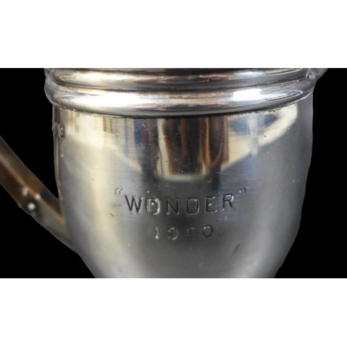 80 - A late Victorian silver hot water pot, with presentation engraving to the side 'Wonder 1900', the hi... 