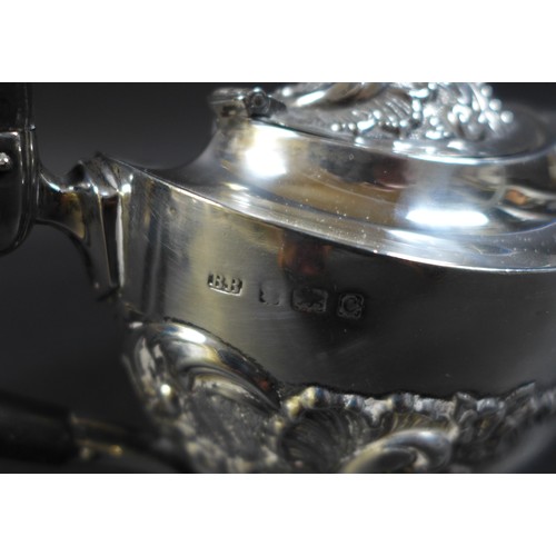 90 - An Edward VII silver three piece bachelors tea set, comprising a teapot, 22.5 by 9 by 12cm high, twi... 