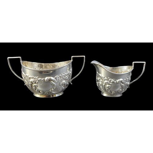 90 - An Edward VII silver three piece bachelors tea set, comprising a teapot, 22.5 by 9 by 12cm high, twi... 