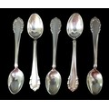 Five Georg Jensen Lily of the Valley pattern silver teaspoons, comprising one circa 1925 teaspoon, a... 