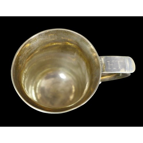69 - A George III silver tankard, of baluster form, the S scroll handle with heart shaped terminal and en... 