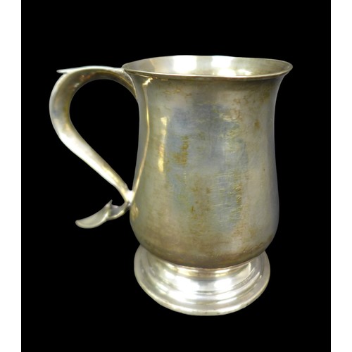 69 - A George III silver tankard, of baluster form, the S scroll handle with heart shaped terminal and en... 