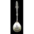 An early 20th century Danish spoon, with shell style decoration to its handle, initials and date 'E&... 