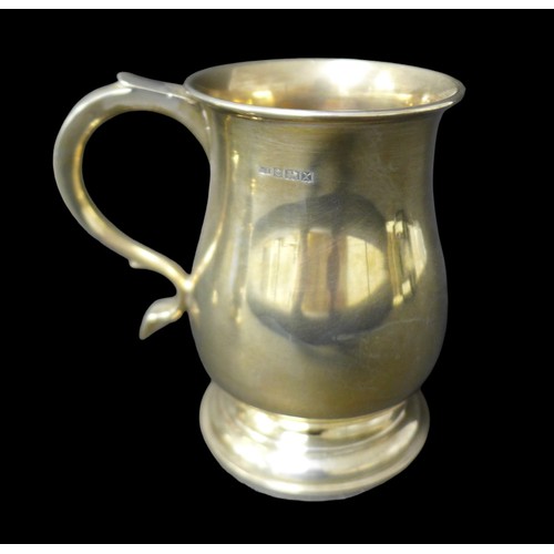96 - A group of four silver tankards, largest in Georgian style with heart shaped terminal to handle, 14c... 