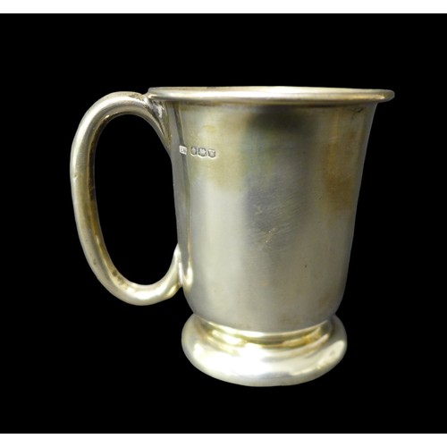 96 - A group of four silver tankards, largest in Georgian style with heart shaped terminal to handle, 14c... 