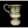 A William IV silver tankard, of urn form with foliate scroll handle, later repousse decoration, cart... 
